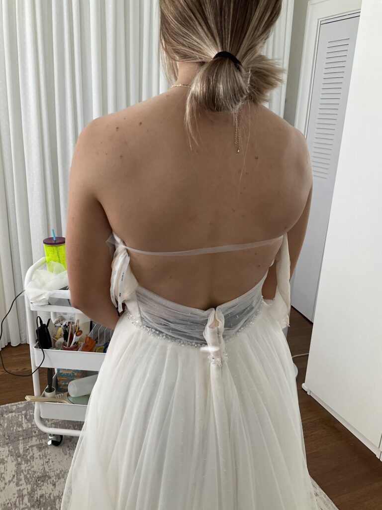 a poorly fit wedding dress before magical alterations