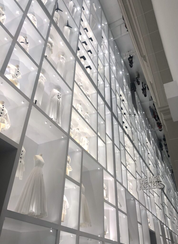floor to ceiling wall of Dior toiles